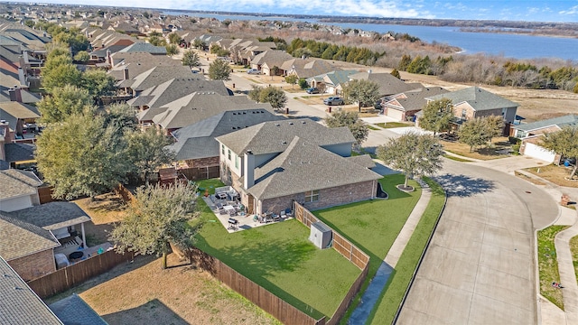 bird's eye view with a residential view and a water view