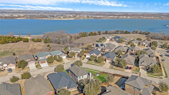 bird's eye view with a water view and a residential view