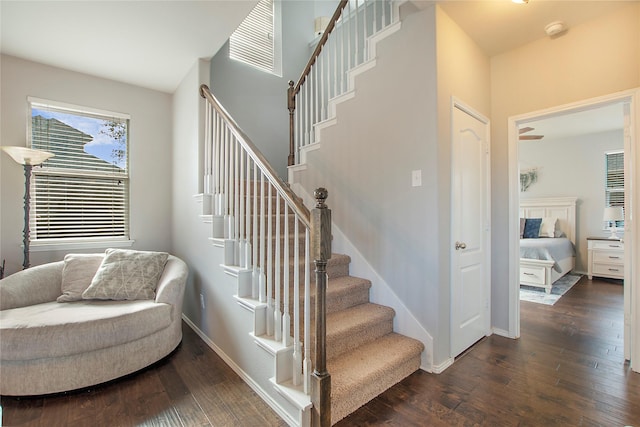 stairway with baseboards and wood finished floors