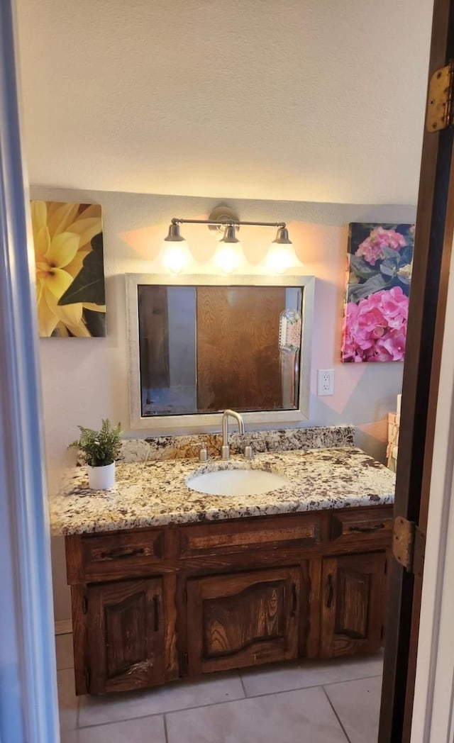 bathroom with vanity and tile patterned floors