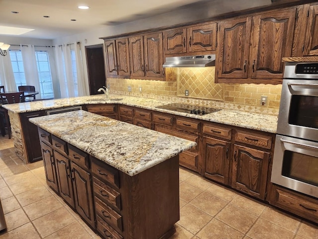 kitchen with a center island, a peninsula, range hood, black electric cooktop, and stainless steel double oven