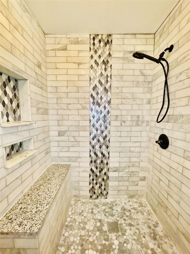 bathroom featuring tiled shower