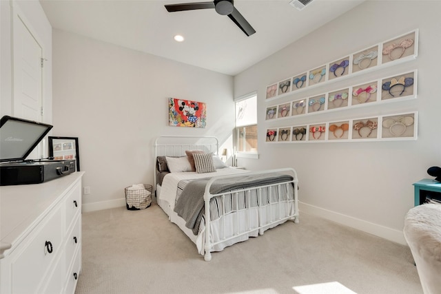 bedroom featuring light carpet, baseboards, a ceiling fan, and recessed lighting