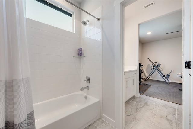 full bathroom with vanity, visible vents, baseboards, marble finish floor, and shower / bath combo