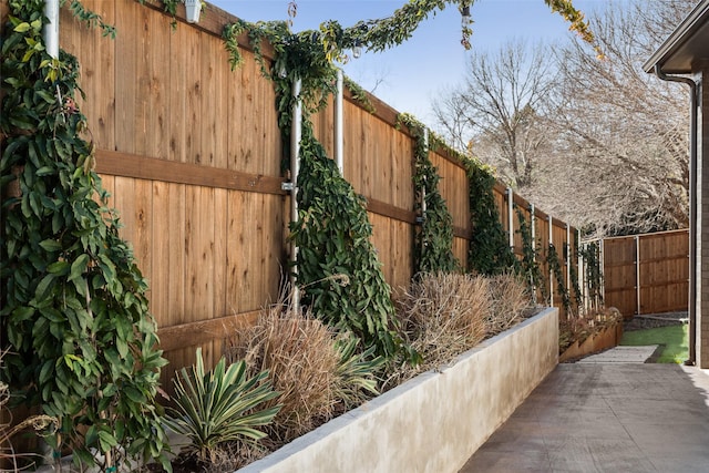 view of side of home with fence