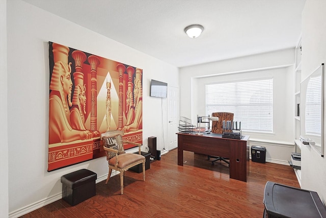 office featuring baseboards and wood finished floors