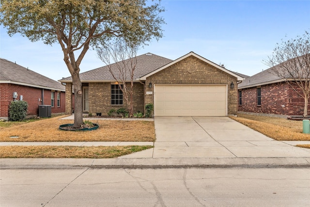 ranch-style house featuring driveway, a shingled roof, an attached garage, central AC, and brick siding