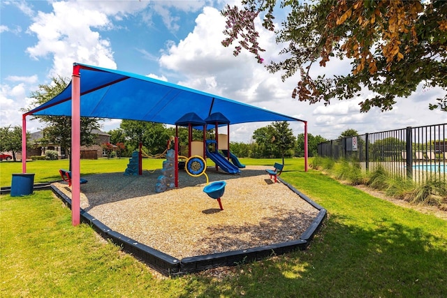 community playground with fence and a yard