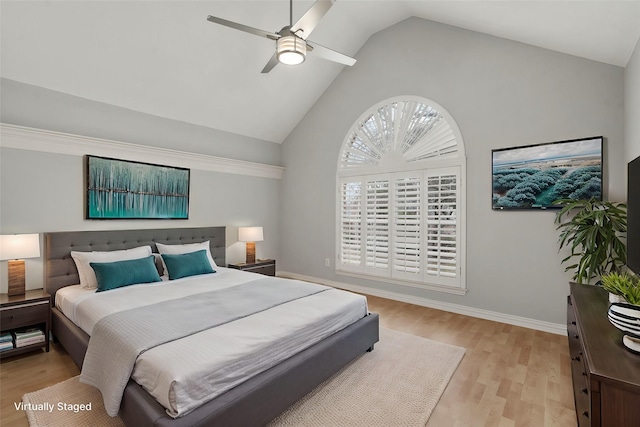 bedroom featuring a ceiling fan, high vaulted ceiling, light wood-style flooring, and baseboards