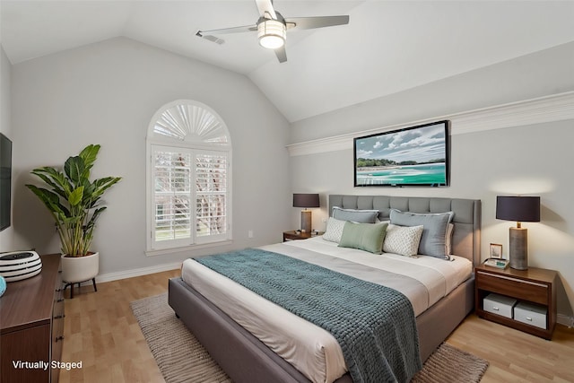 bedroom featuring visible vents, light wood-style floors, vaulted ceiling, ceiling fan, and baseboards