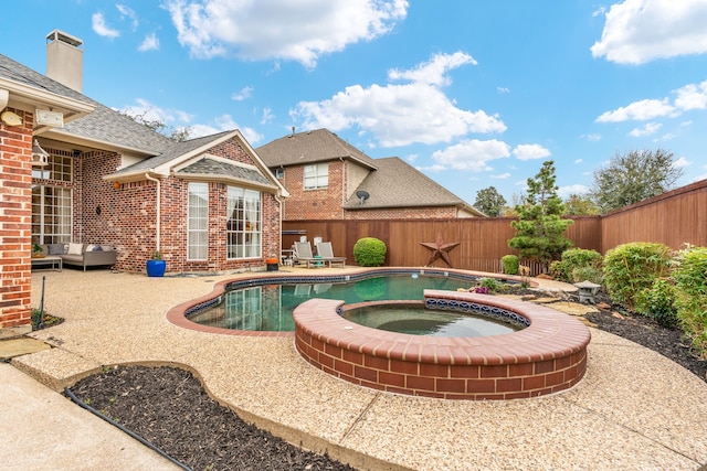 view of swimming pool featuring an in ground hot tub, a patio area, a fenced backyard, and a fenced in pool