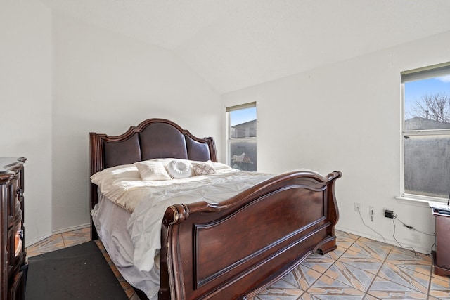 bedroom featuring lofted ceiling