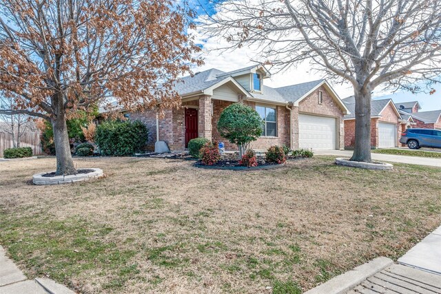 single story home featuring a front yard, concrete driveway, a garage, central air condition unit, and brick siding