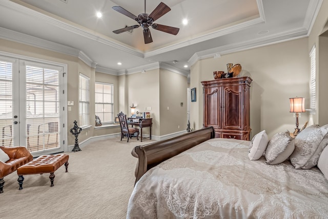 bedroom with crown molding, access to outside, a tray ceiling, and light colored carpet