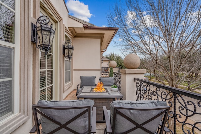 balcony featuring a fire pit