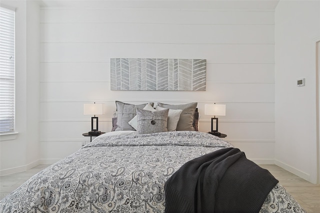 bedroom with baseboards and light wood-style floors