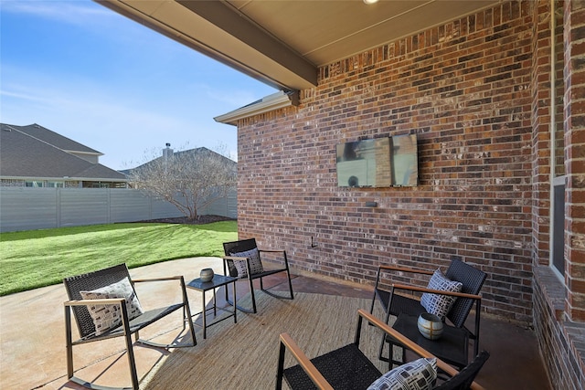 view of patio featuring fence