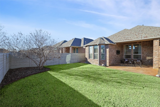 view of yard with a fenced backyard and a patio