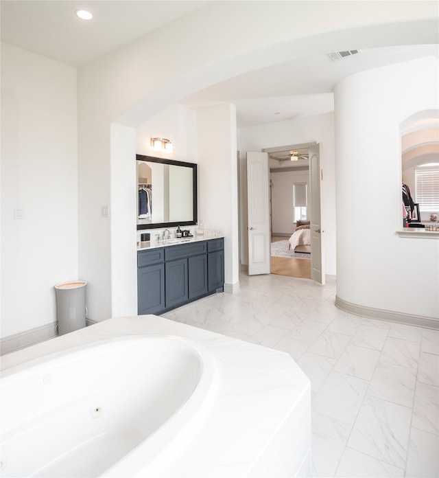 full bath with visible vents, a jetted tub, recessed lighting, ensuite bathroom, and marble finish floor