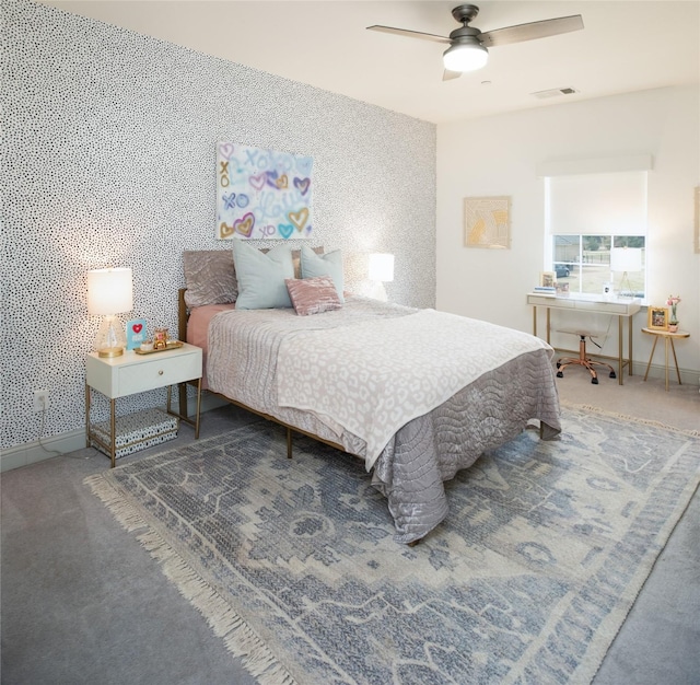 bedroom with wallpapered walls, visible vents, baseboards, and carpet floors