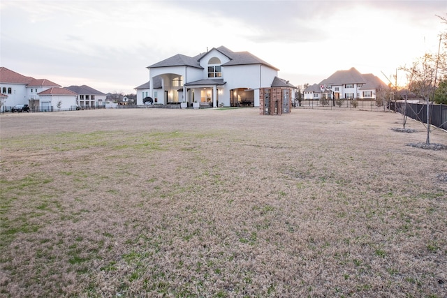 view of yard with a residential view and fence