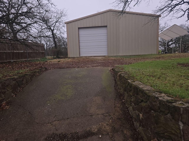 detached garage featuring driveway