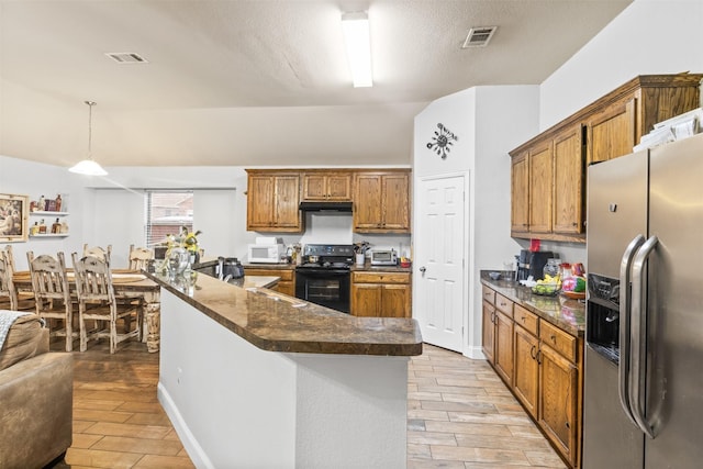 kitchen featuring black / electric stove, under cabinet range hood, stainless steel fridge with ice dispenser, brown cabinets, and pendant lighting