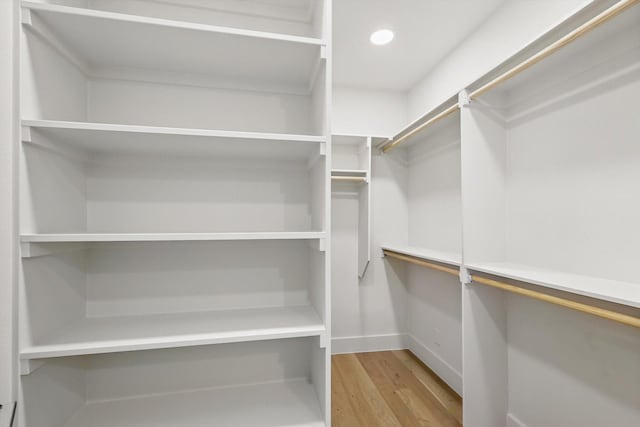 spacious closet featuring light wood-style flooring