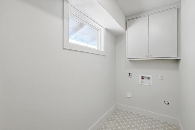 washroom featuring gas dryer hookup, hookup for a washing machine, hookup for an electric dryer, baseboards, and cabinet space