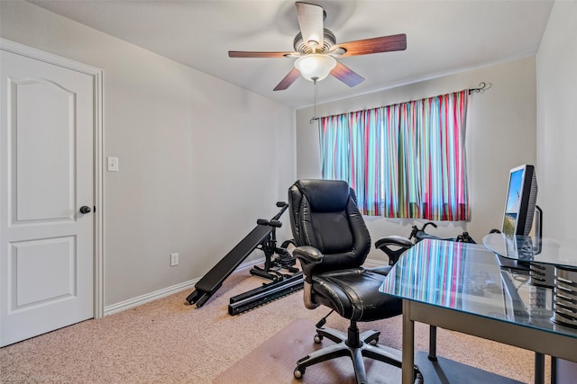 home office featuring carpet flooring, ceiling fan, and baseboards