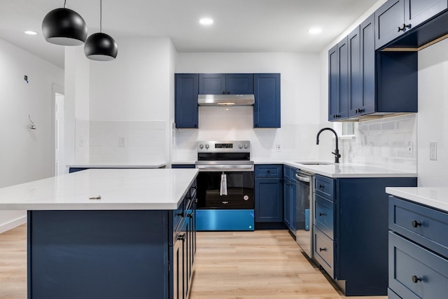 kitchen featuring light wood-style floors, stainless steel appliances, light countertops, under cabinet range hood, and a sink