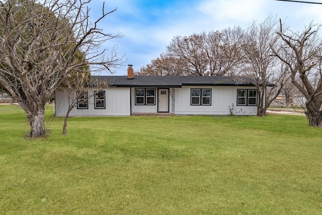 single story home featuring a front yard and a chimney