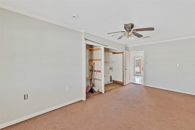 unfurnished room featuring baseboards, visible vents, a ceiling fan, ornamental molding, and carpet floors