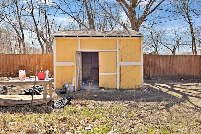 view of shed with a fenced backyard