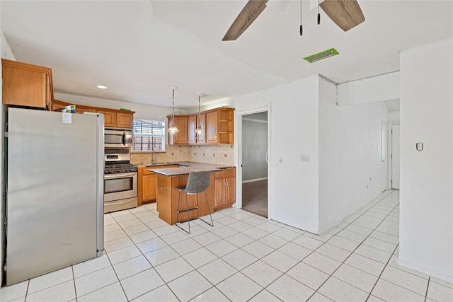 kitchen with decorative light fixtures, open shelves, stainless steel appliances, a peninsula, and a kitchen breakfast bar