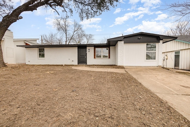 view of front of home featuring brick siding