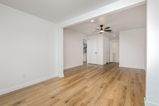 empty room featuring ceiling fan, recessed lighting, light wood-type flooring, and baseboards