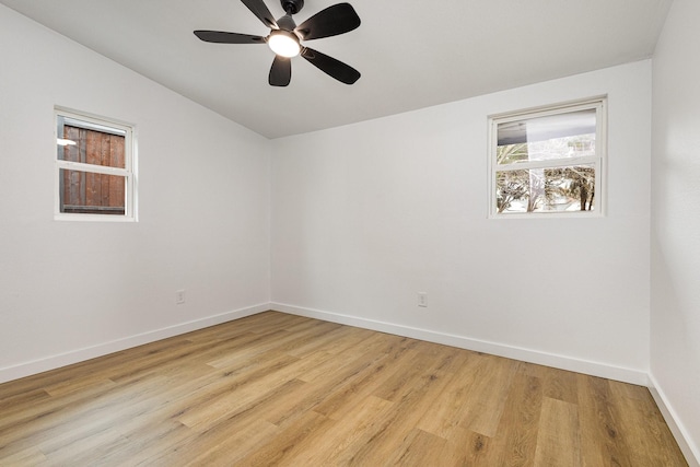 unfurnished room featuring light wood-style floors, ceiling fan, and baseboards