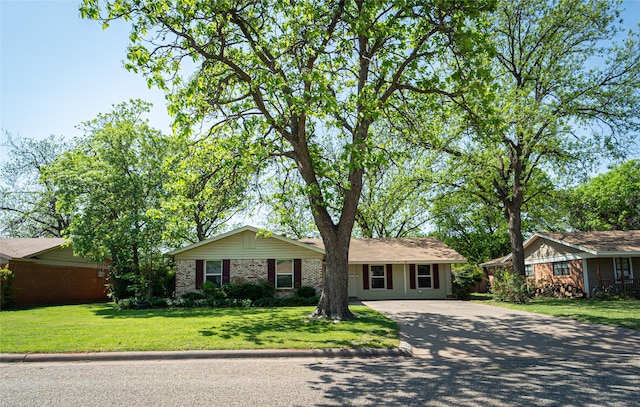 3813 Concord Dr, Abilene, TX 79603 - single story home with concrete driveway, a front yard, and brick siding
