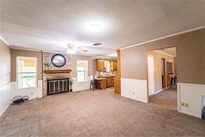 3813 Concord Dr, Abilene, TX 79603 - living room featuring crown molding, carpet, a brick fireplace, and a textured ceiling