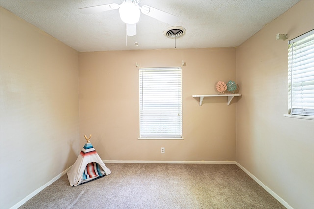 3813 Concord Dr, Abilene, TX 79603 - spare room with carpet, ceiling fan, and a textured ceiling