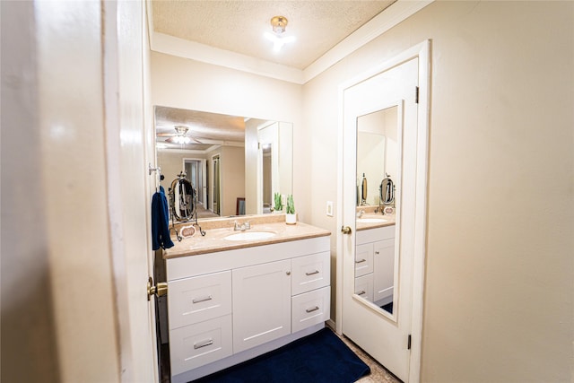 3813 Concord Dr, Abilene, TX 79603 - bathroom with a textured ceiling, vanity, crown molding, and ceiling fan