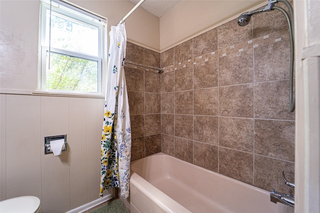 3813 Concord Dr, Abilene, TX 79603 - full bath featuring shower / bath combination with curtain and wainscoting