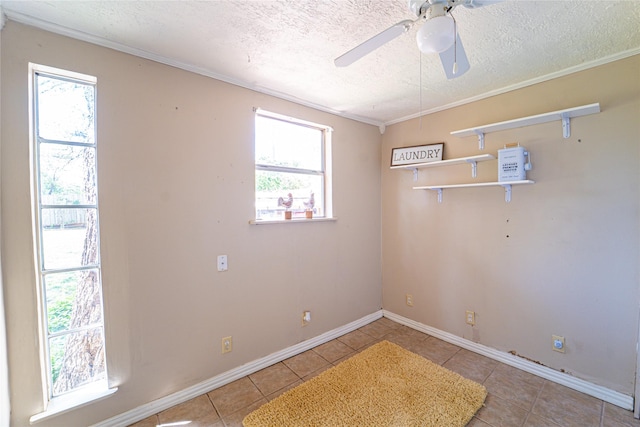 3813 Concord Dr, Abilene, TX 79603 - unfurnished room featuring a textured ceiling, light tile patterned floors, ceiling fan, and ornamental molding