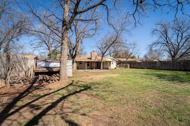 view of yard with a fenced backyard