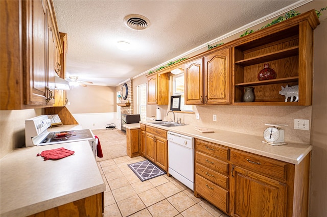 3813 Concord Dr, Abilene, TX 79603 - kitchen featuring white appliances, brown cabinets, a textured ceiling, light countertops, and open shelves