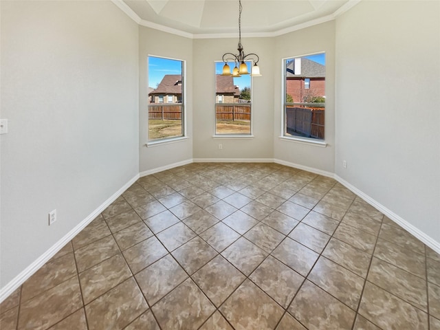 unfurnished dining area with baseboards, ornamental molding, a raised ceiling, and an inviting chandelier