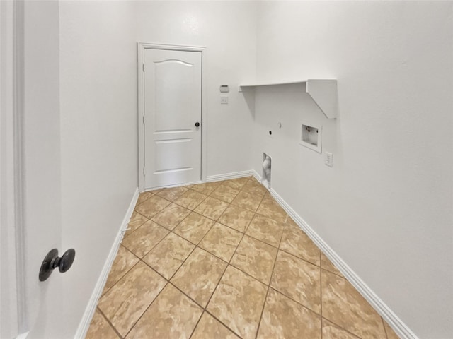 laundry area with laundry area, baseboards, gas dryer hookup, hookup for an electric dryer, and washer hookup