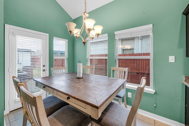 dining room featuring lofted ceiling, light tile patterned floors, baseboards, and an inviting chandelier