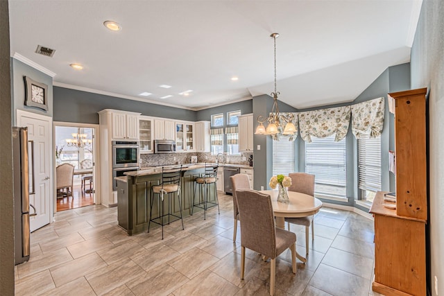 dining room with crown molding, recessed lighting, visible vents, and a notable chandelier